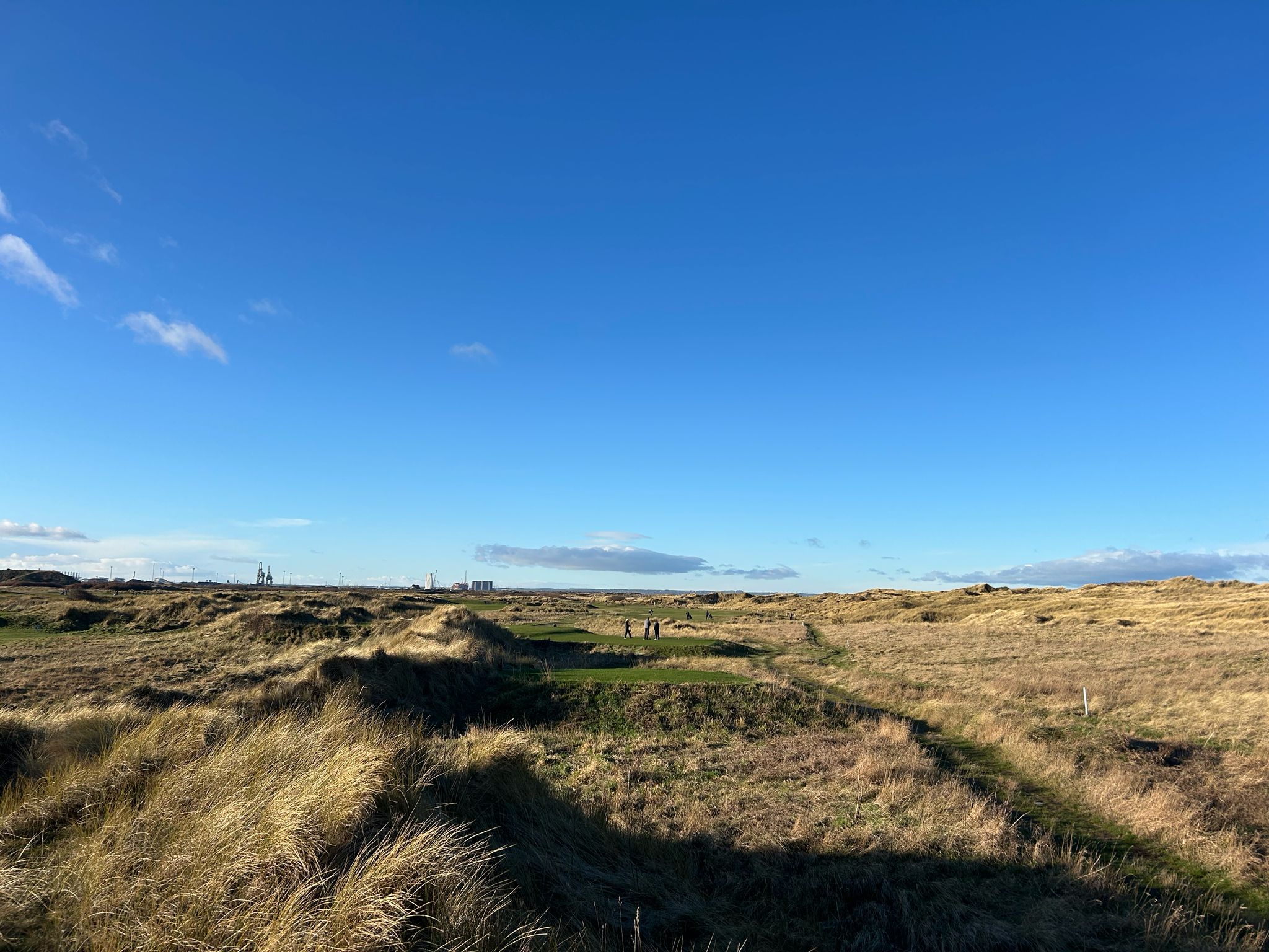 A golf society group walking the fairway during a round at Cleveland Golf Club
